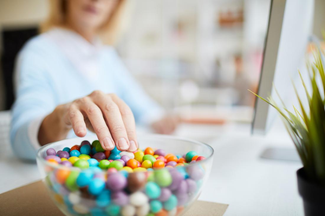 close up of someone eating sweet beans
